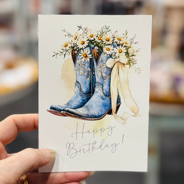 Cowgirl boots & daisies greeting card